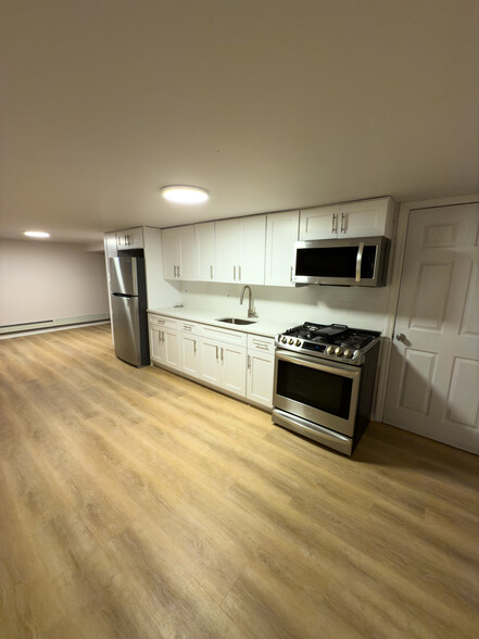 Kitchen/Living Area (Entryway far right corner) - 9517 Rockaway Beach Blvd