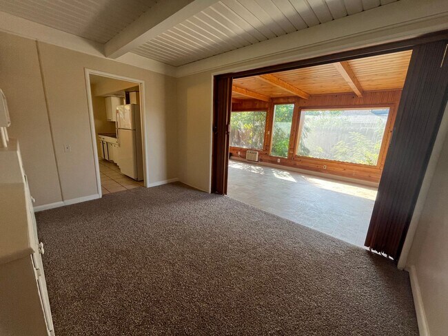 Building Photo - 2 bed 1 bath single family home with back yard and garage space