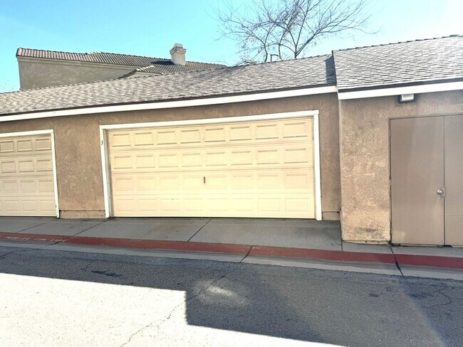 Building Photo - 2 Bedroom, 2 Bath Upstairs Condo with Private Balcony & 2-Car Garage, Gated Community, Water/Tras...