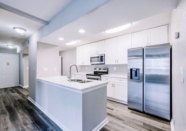 Building Photo - Spacious 2-Bedroom Elite Apartment with Private Balconies & Washer/Dryer