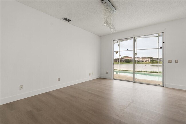 Building Photo - Stunning 4-Bedroom Lakefront Pool Home in Bridgeview at Meadow Woods