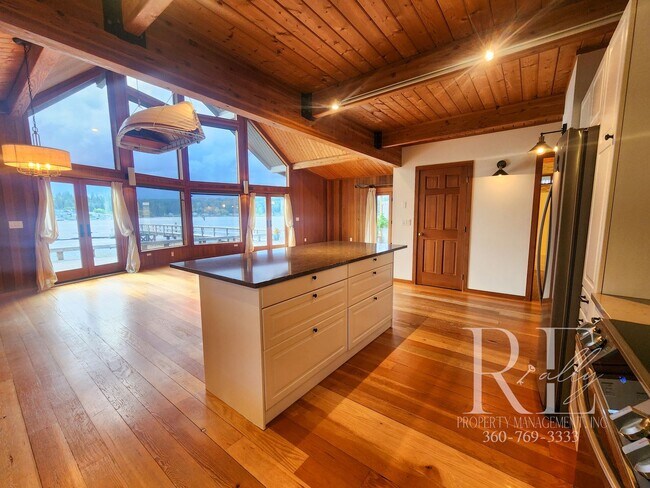 Building Photo - Waterfront Living in Indianola – Dock, Bea...