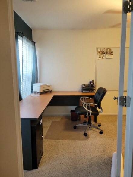 Office with L shaped desk, chair, and printer - 204 Silk Oak Dr