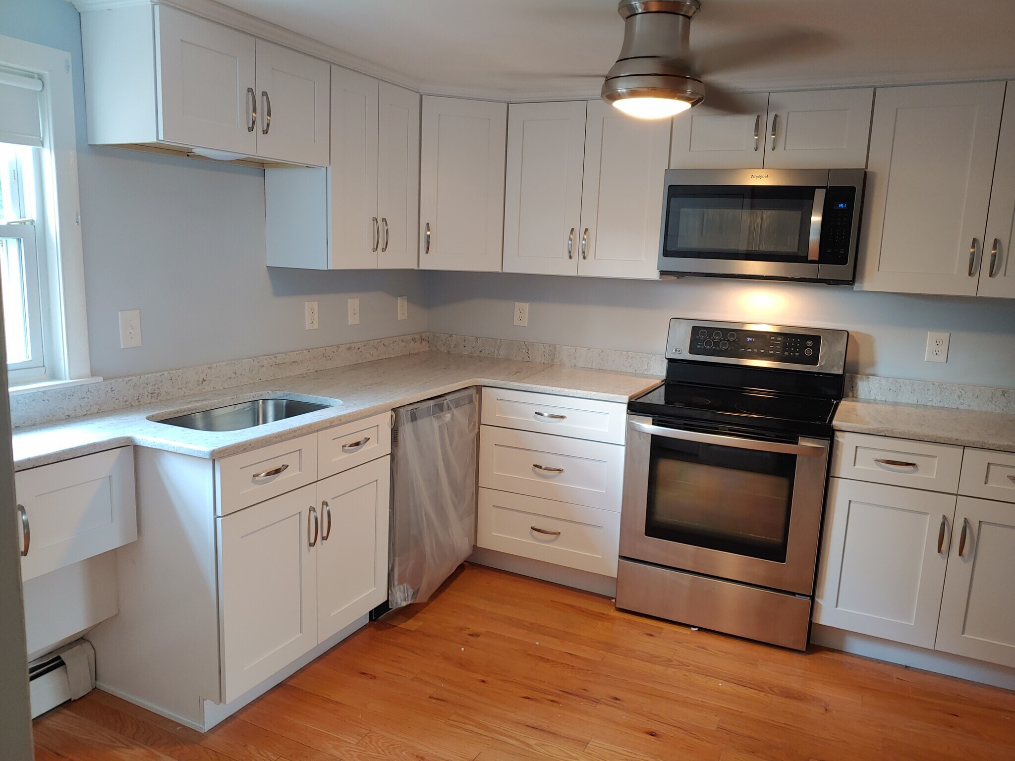 Newly remodleded kitchen quartz counter, dishwasher, stove, microwave and brand new refrigerator - 623 Old West Central St