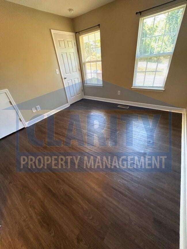 Building Photo - Charming three-bedroom home with carport!
