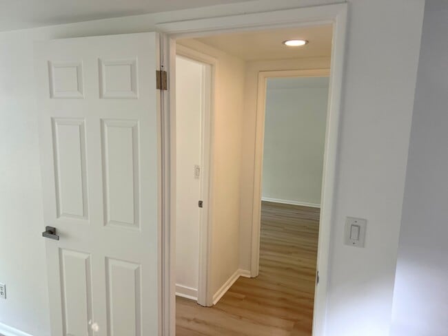 inside bedroom #4 looking at bathroom (L) and into bedroom #3 - 4662 Carman Dr