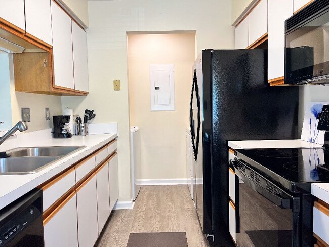 Kitchen view from dinette to washer/dryer area. - 704 Rapidan River Ct
