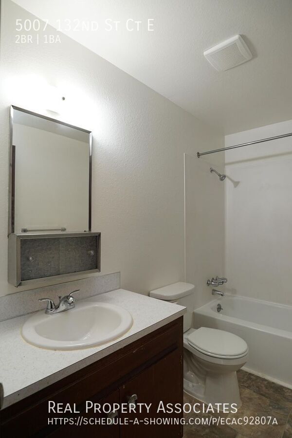 Building Photo - Spacious Two Bedroom Duplex Home with an A...