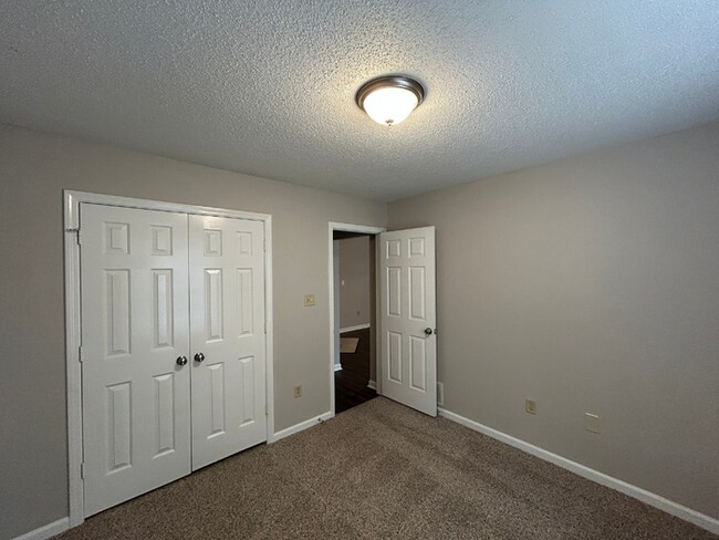 Building Photo - Spacious 3BR/2BA Lake Community Home | Soaring High Ceilings, Fireplace & 2-Car Garage