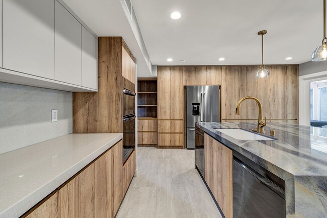 Building Photo - Stunning Remodeled 4-Bedroom Home in Exclu...