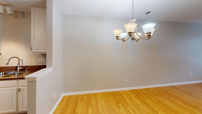 Building Photo - Experience urban living in this stylish to...