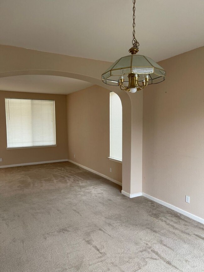 Building Photo - Spacious two-story home available for rent featuring 4 bedrooms, 2.5 bathrooms, and a three-car g...