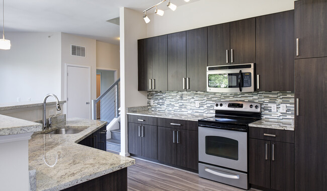 Modern kitchens with granite countertops, stainless steel appliances, and tile backsplash - Avery Row