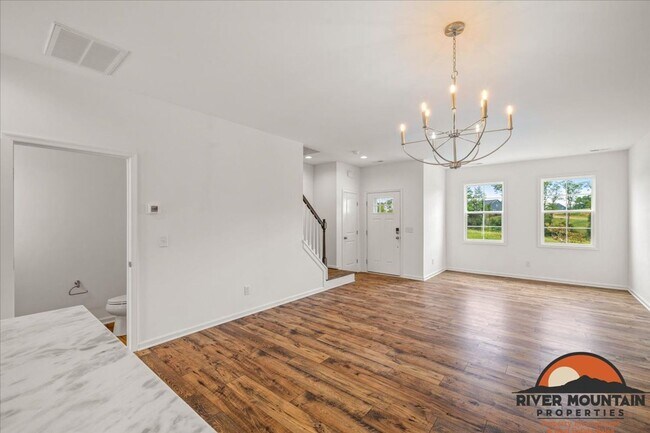 Building Photo - Well-Located Townhome with Private Off-Street Parking
