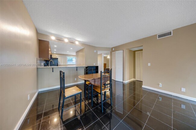 Building Photo - 6075 N Sabal Palm Blvd