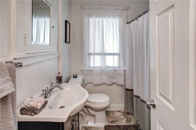 Building Photo - Timeless Charm Meets Thoughtful Updates in This Light-Filled Retreat