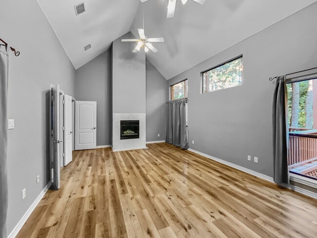 Primary bedroom with gas fireplace. - 1314 Creekwood Dr