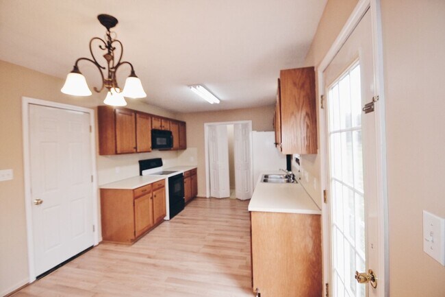 Building Photo - Available July 7th, 2026! Tons of Storage in this 3/2 with 2 garages for rent in Conover NC.