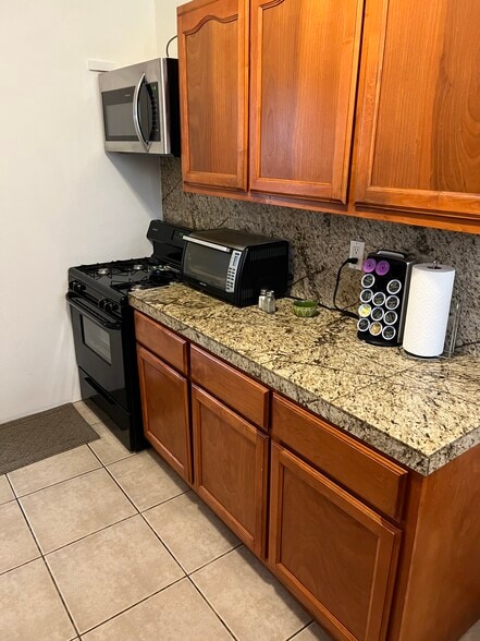 Multi-faceted gas range stove, oven & microwave - 607 N Garfield Ave