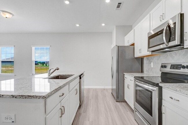 Building Photo - DRAKE ESTATES 3 BR | 2 BA Townhome w/ 2-Car Garage! *Built in 2023*