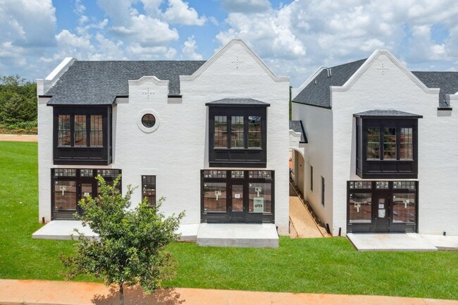 Building Photo - Bright. Clean. Calm. Your Elevated One-Bed...