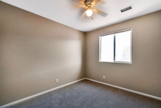 Building Photo - 3BR Townhome Near DIA & Light Rail | New Carpet, Garage & Fenced Patio