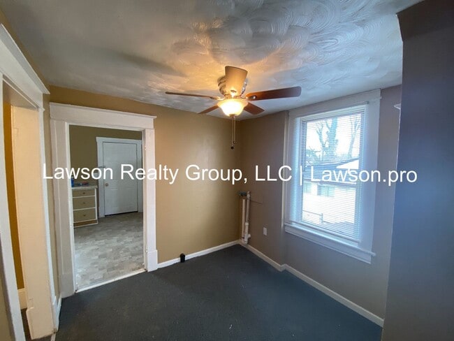 Building Photo - Updated Three Bedroom with Flat Yard