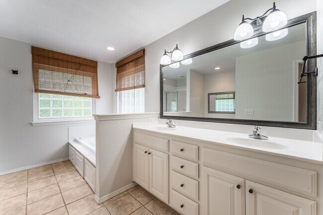 Building Photo - Spacious Bella Vista Retreat with Sunlit Interiors & Outdoor Oasis