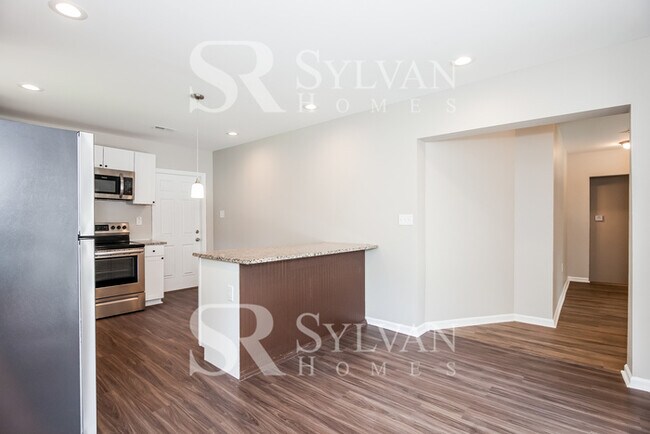 Building Photo - Turn the key. Enter. Smile. Repeat every day!