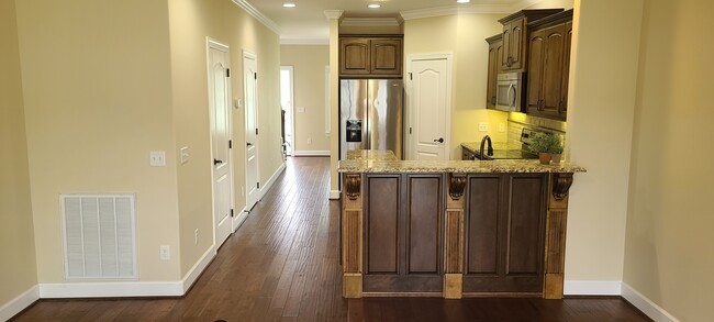 Kitchen area w/custom bar - 1974 N Dixie Ave