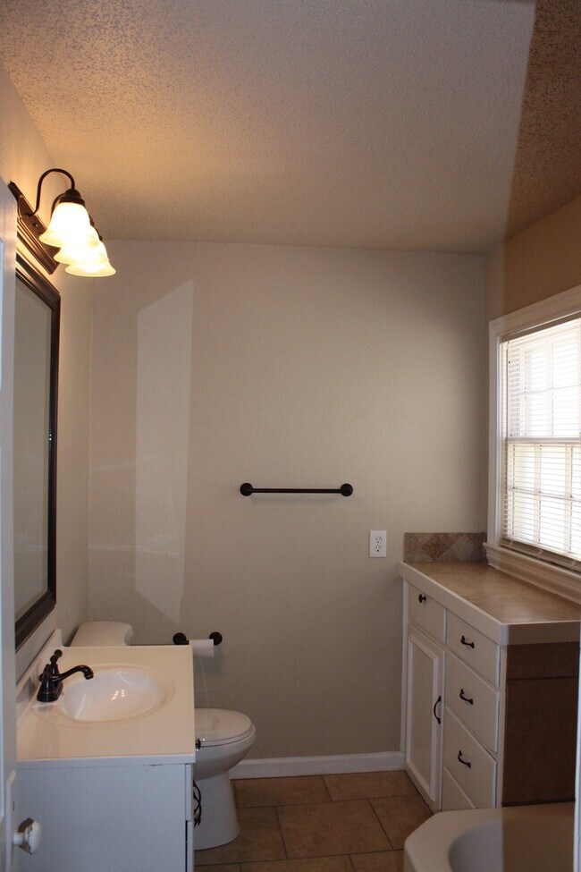 Building Photo - PRE -LEASING FOR AUGUST ! Spacious 4 Bedroom/2 Bath House