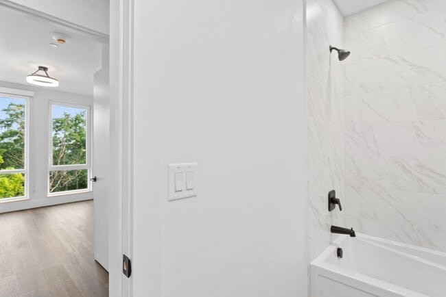 Building Photo - 2 Bedroom Corner-Unit with Wooded Balcony ...