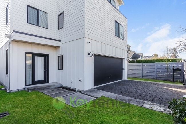 Building Photo - Spacious Living with Balconies, Deck, and Private Yard