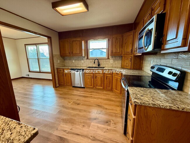 Building Photo - Spacious 3 Bedroom Home with Finished Lower Level & Large Fenced Yard