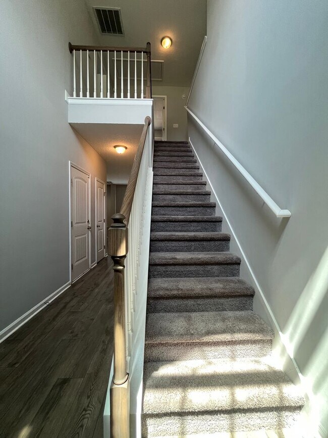 Building Photo - Spacious 4-Bedroom Pet Friendly Home with a Serene View - Available for Rent!