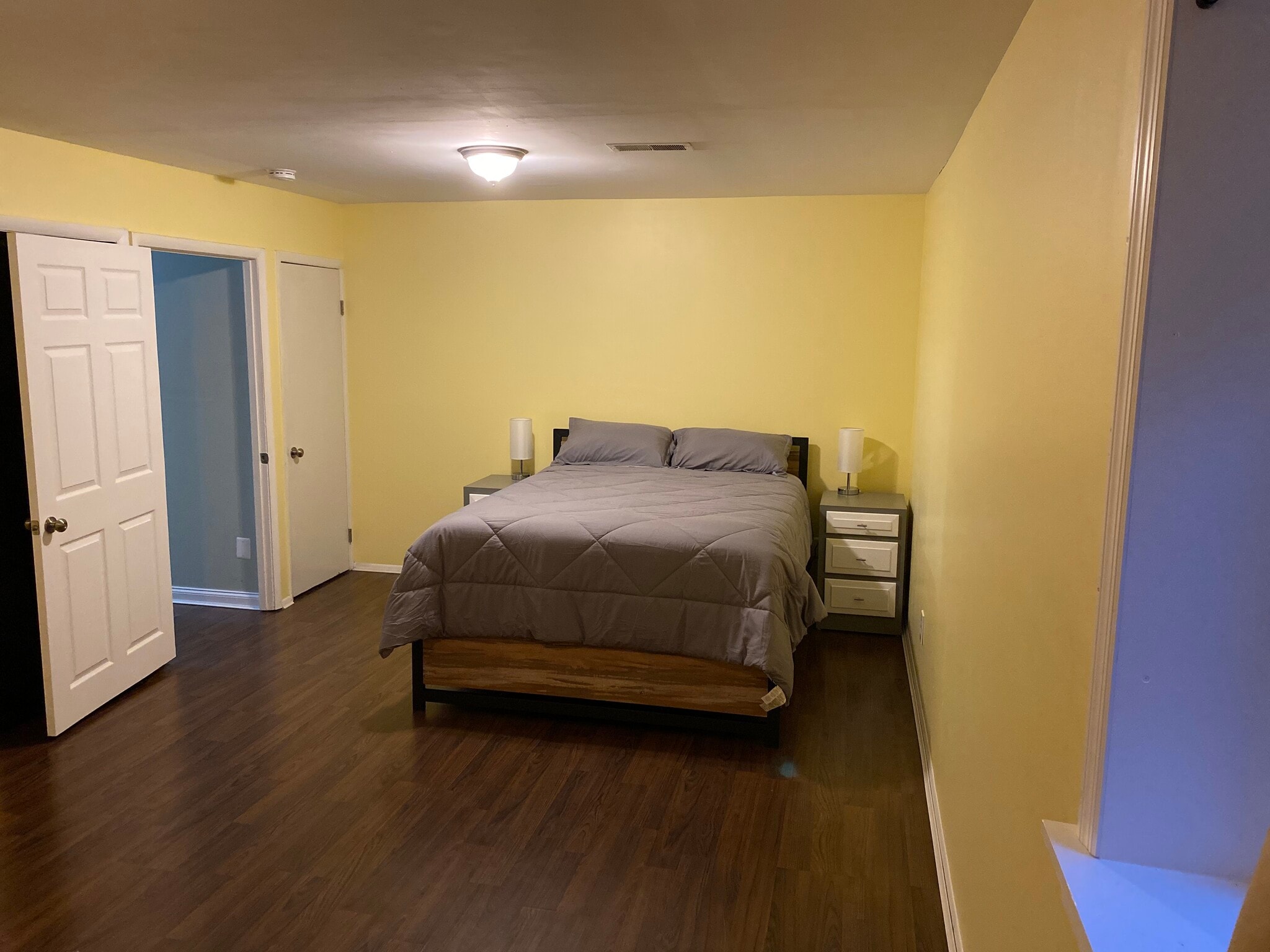 Large queen size bed only takes up a small portion of the room. - 8371 Stationhouse Ct