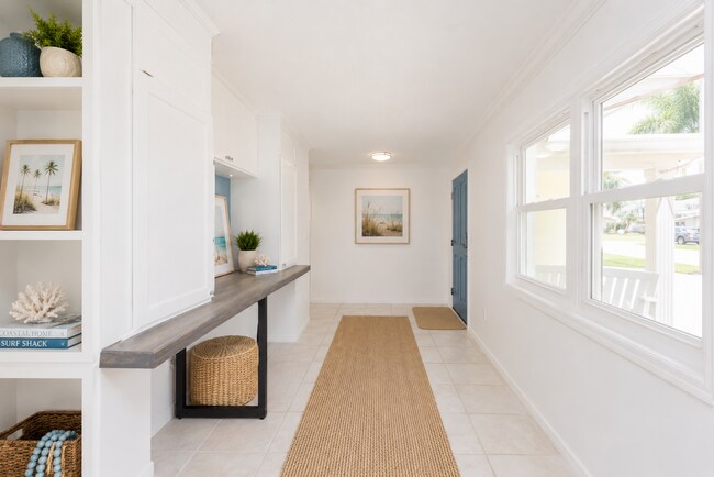 Building Photo - Live the ultimate Space Coast waterfront lifestyle at this stunning beachside canal home in Satel...