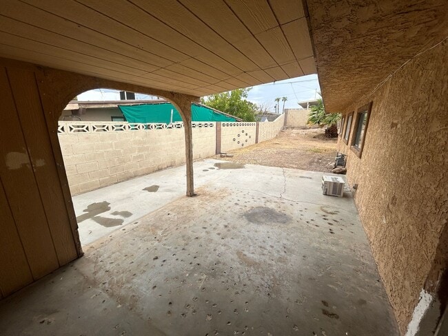 Building Photo - Single story home with large backyard and huge carport with plenty of storage.