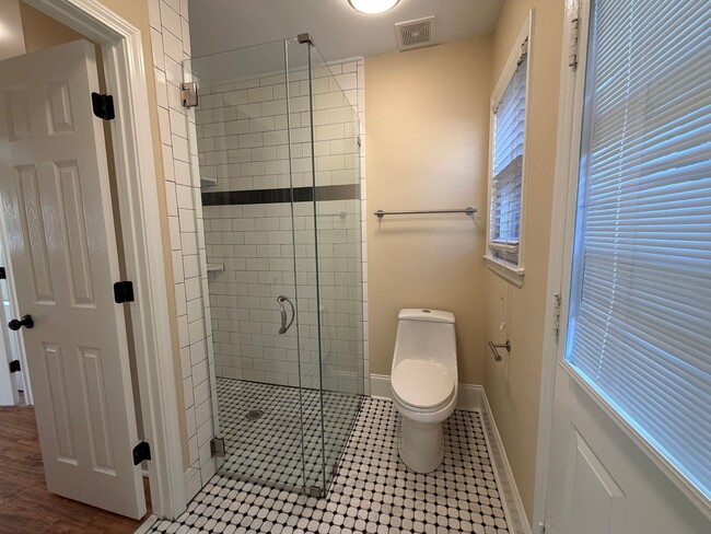 Building Photo - Freshly Painted Split-Level Home with Large Deck & Lawn Care Included