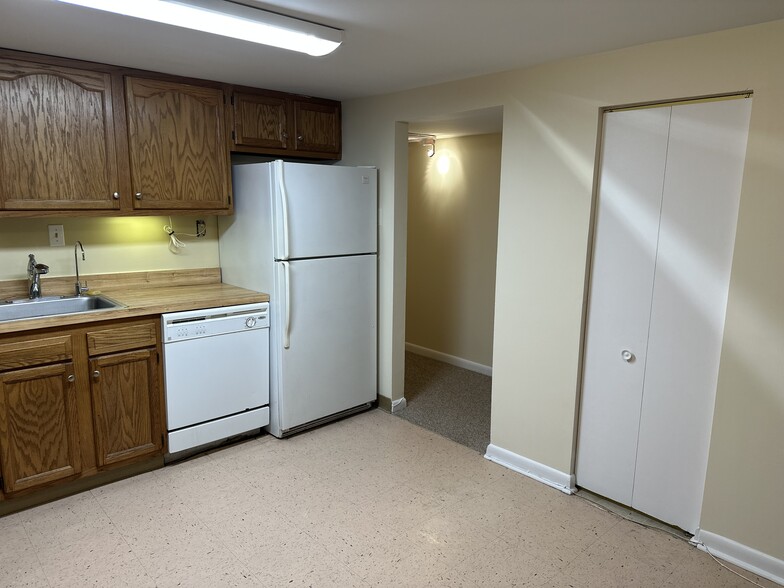 Kitchen toward art gallery hallway - 1336 Kenyon St NW