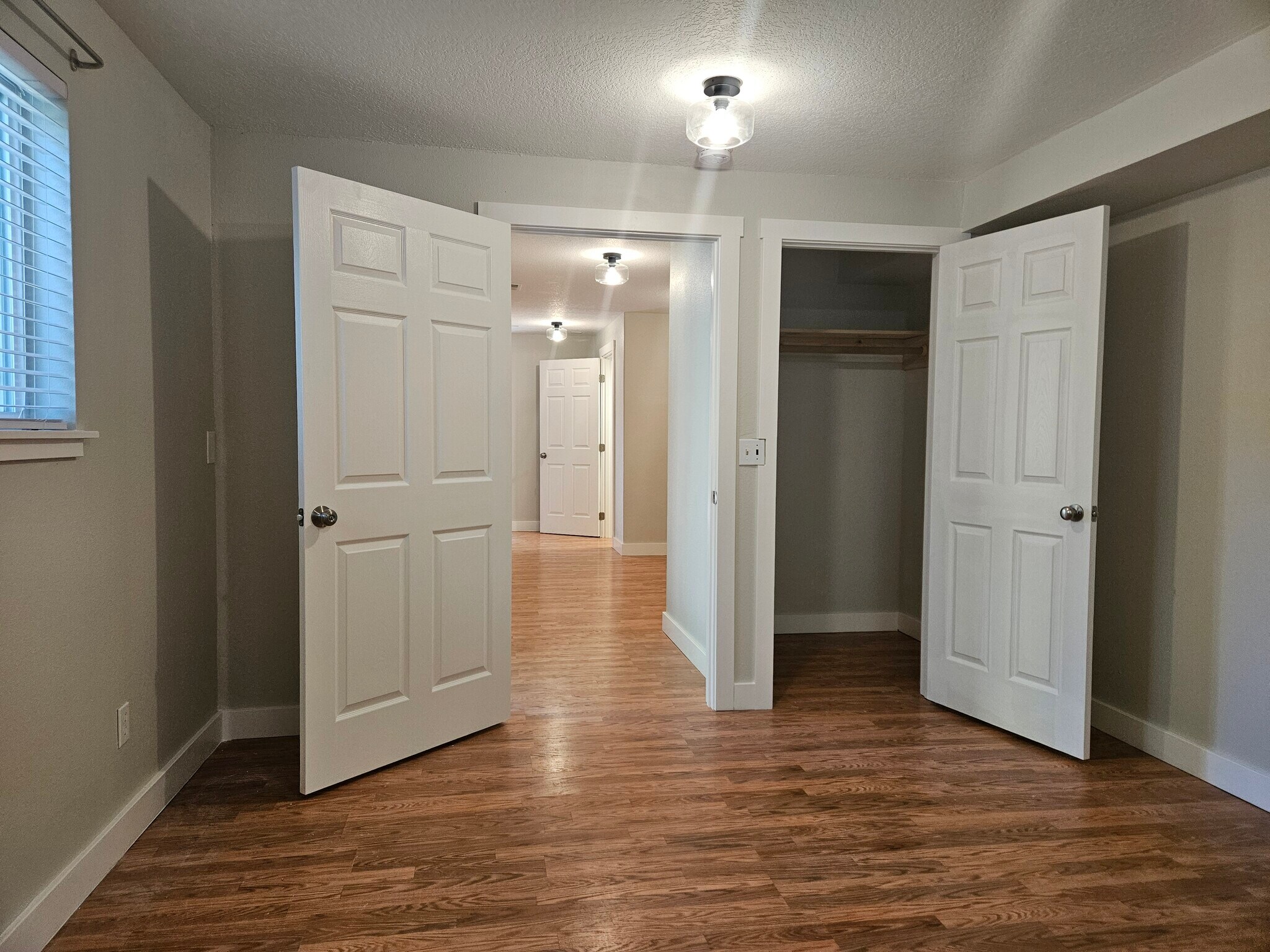 main level bedroom looking out. Walk-in closet - 13235 SE Oatfield Rd