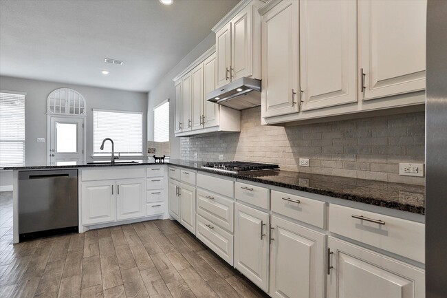 Kitchen opens to living room - 253 Gill Point Ln