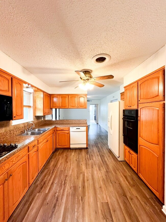 Building Photo - Available Now!!!! Gorgeous 3 bedroom, 2 bath, 2 car garage home. Beautiful wood look flooring. Sp...