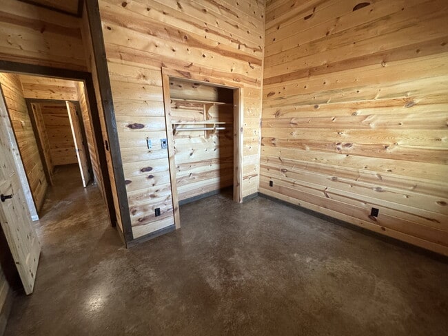 Building Photo - 2 bed 2 bath fourplex. Stained concrete floors. Washer & Dryer hookups in unit.