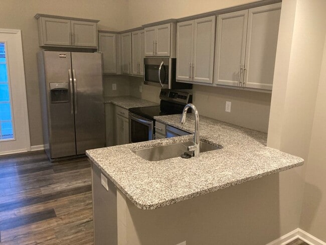 Building Photo - COMING SOON!!! End Unit townhome in Westwi...