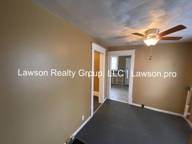 Building Photo - Updated Three Bedroom with Flat Yard