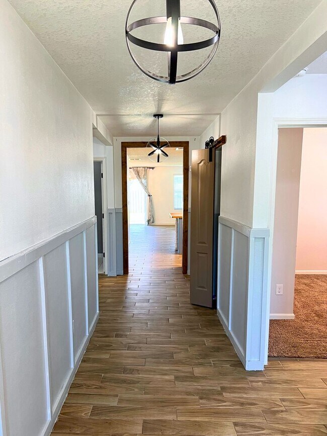 Building Photo - Stylish 4-Bedroom Home with Fenced Yard – ...