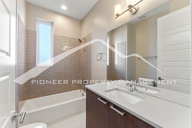 Building Photo - Fantastic Townhome with A Roof Top Patio, Attached Garage, and Central AC!
