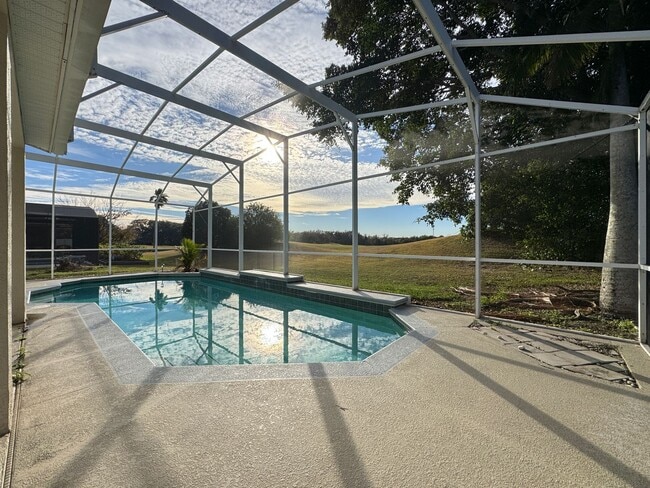 Building Photo - Spacious 4-Bedroom Home with Private Pool and Modern Comforts