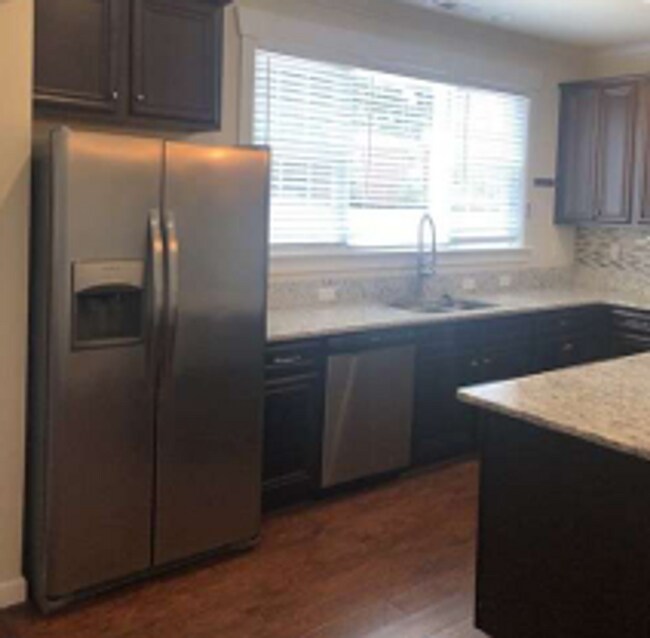 Building Photo - Spacious Four Bedroom Available July 3